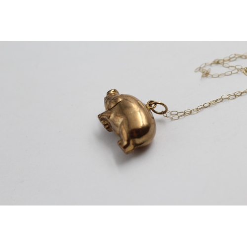 2144 - A 9ct gold lucky pig pendant necklace - approx. gross weight 2.3g