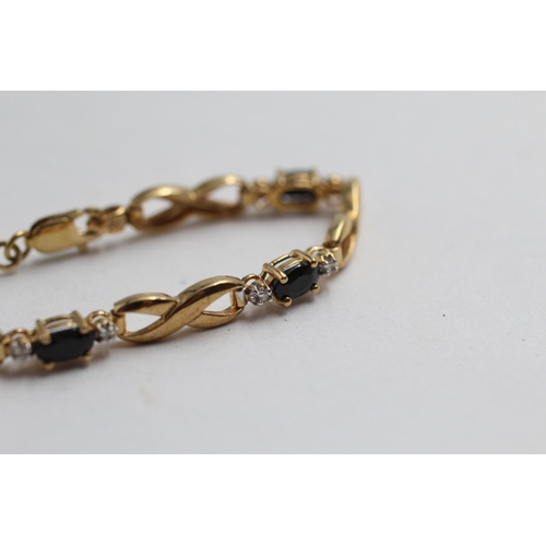 2148 - A 9ct gold sapphire and diamond infinity link bracelet - approx. gross weight 5.4g