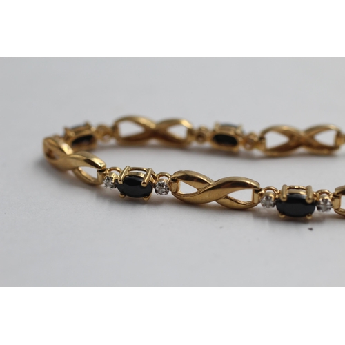 2148 - A 9ct gold sapphire and diamond infinity link bracelet - approx. gross weight 5.4g