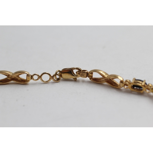 2148 - A 9ct gold sapphire and diamond infinity link bracelet - approx. gross weight 5.4g