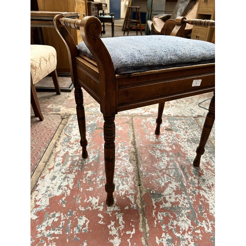 47 - An Edwardian beech and blue fabric upholstered piano stool