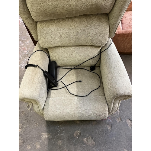 72 - A modern fabric upholstered electric reclining armchair with remote and power supply