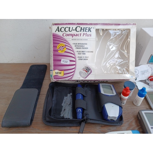 514 - Four items, one boxed Easy@Home TENS and muscle stimulator, one AlcoSense breathalyser, one Accu-Che... 