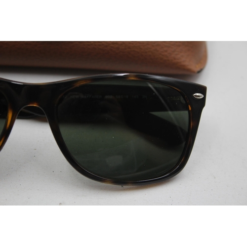 2382 - A pair of Ray-Ban Wayfarer brown tortoishell sunglasses with original case