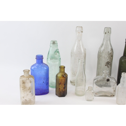 267 - A collection of antique and vintage glass bottles