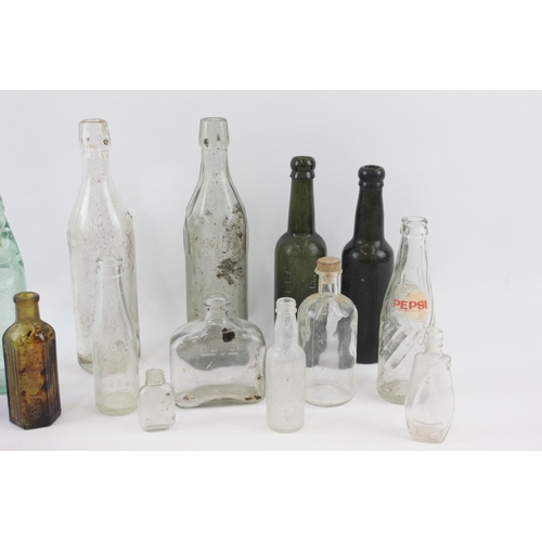 267 - A collection of antique and vintage glass bottles