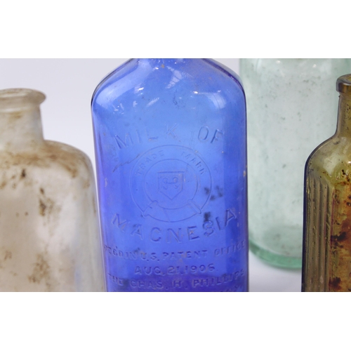 267 - A collection of antique and vintage glass bottles