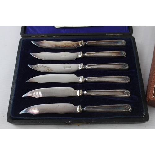 327 - Two vintage boxed silver plated cutlery sets