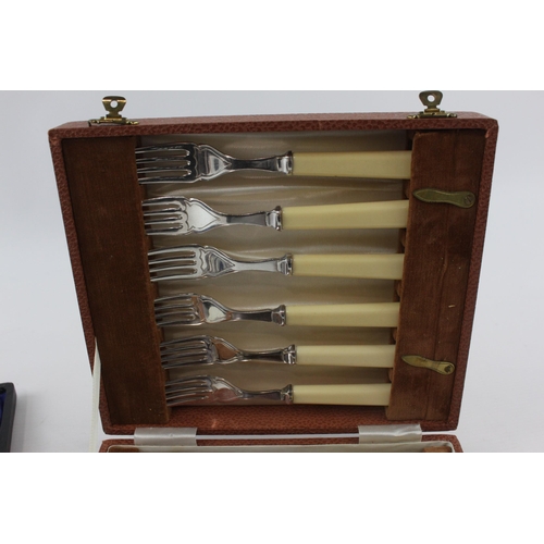 327 - Two vintage boxed silver plated cutlery sets