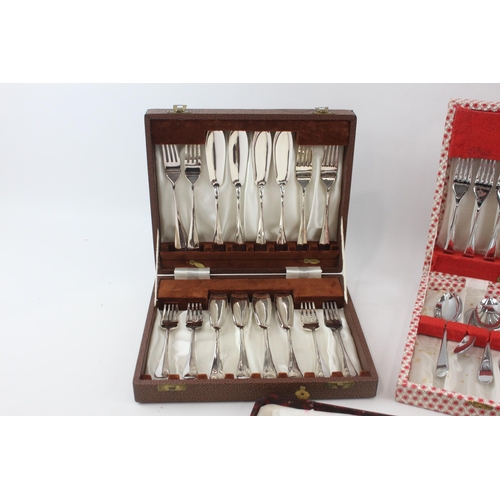 329 - Three vintage boxed cutlery sets to include fish cutlery, carving set etc.