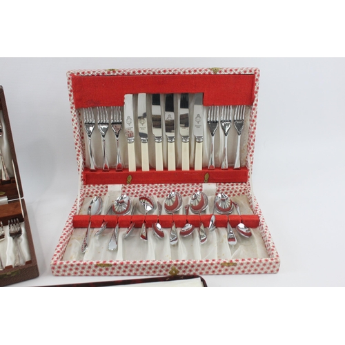 329 - Three vintage boxed cutlery sets to include fish cutlery, carving set etc.