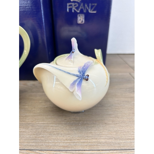 263 - Three pieces of boxed Franz Dragonfly porcelain designed by Jen Woo, teapot, sugar jar and cream jug