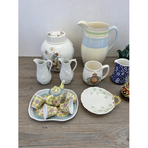 301 - A collection of ceramics and treenware to include Belleek trinket dish, Portmeirion Parian jug, Newh... 