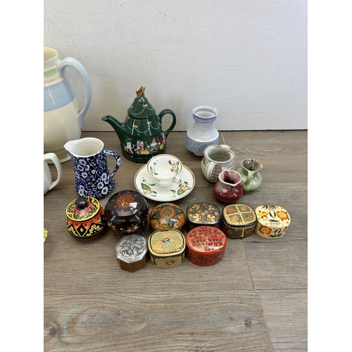 301 - A collection of ceramics and treenware to include Belleek trinket dish, Portmeirion Parian jug, Newh... 