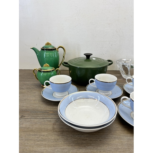 303 - A collection of items to include Le Creuset green enamel and cast iron no. 20 twin handled casserole... 