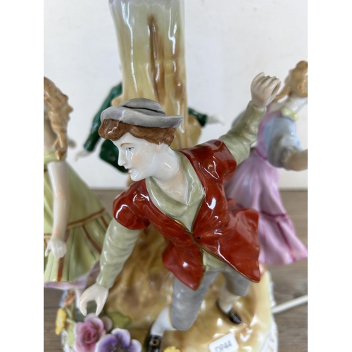 305 - A mid 20th century Plaue Schierholz (PMP) hand painted porcelain figural table lamp - approx. 57cm h... 