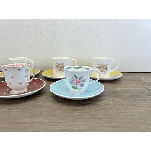 310 - Seven Susie Cooper coffee cups and saucers