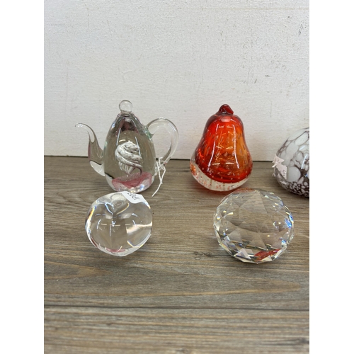 311 - Ten items, nine art glass and onyx paperweights and one Dartington crystal scent bottle