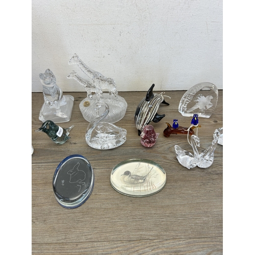 312 - Sixteen art glass animal figurines and paperweights to include RCR giraffes etc.