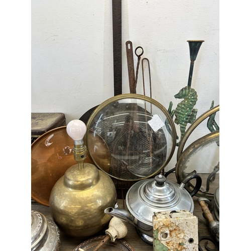 314 - A collection of metalware to include Middle Eastern engraved brass vase, Victorian cast iron skimmer... 