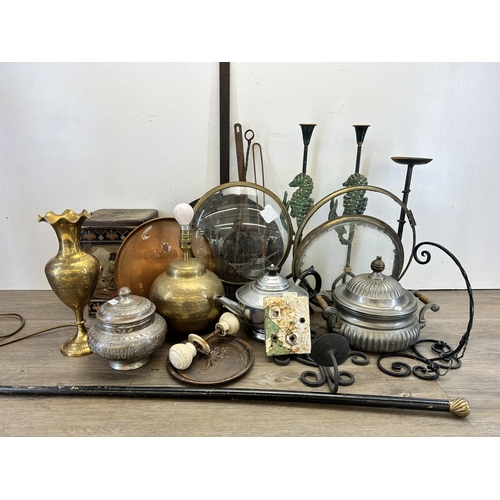 314 - A collection of metalware to include Middle Eastern engraved brass vase, Victorian cast iron skimmer... 