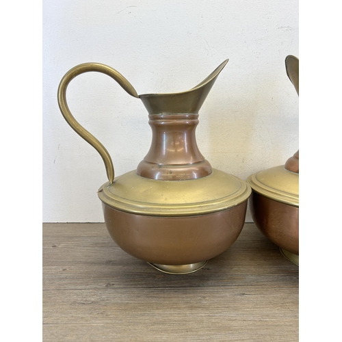 316 - A pair of early 20th century copper and brass pitchers