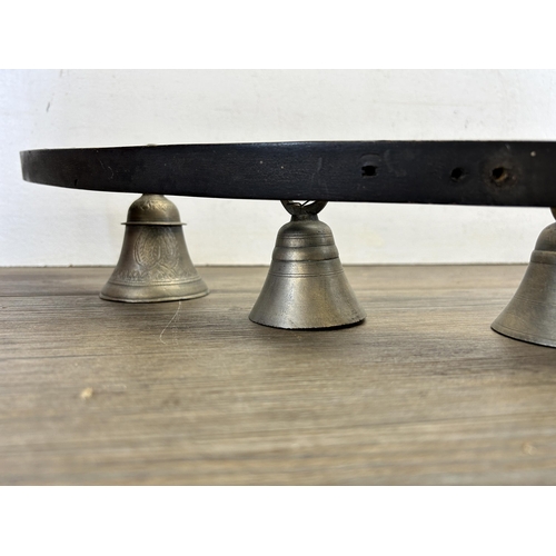 319 - A hardwood and pewter bell door bracket - approx. 33cm high x 87cm wide