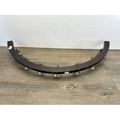 319 - A hardwood and pewter bell door bracket - approx. 33cm high x 87cm wide