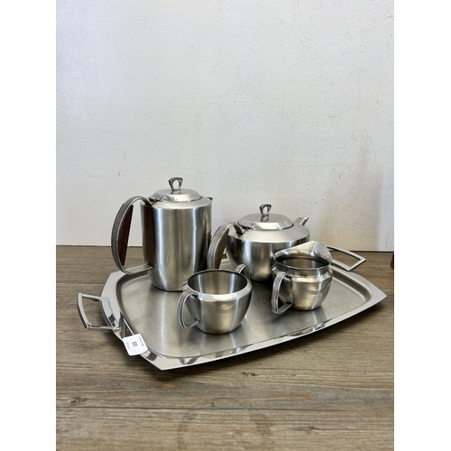 320 - Two coffee and tea sets, one Art Deco Argy copper and ebonised three piece and one Cavalier stainles... 