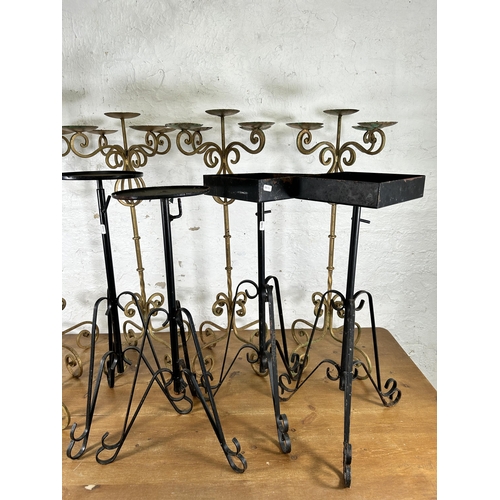 335 - Nine 19th century style wrought metal candelabras and plant stands - largest approx. 91cm high