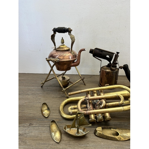 337 - A collection of antique and later metalware to include N.E.C 843 brass trumpet, copper and brass spi... 