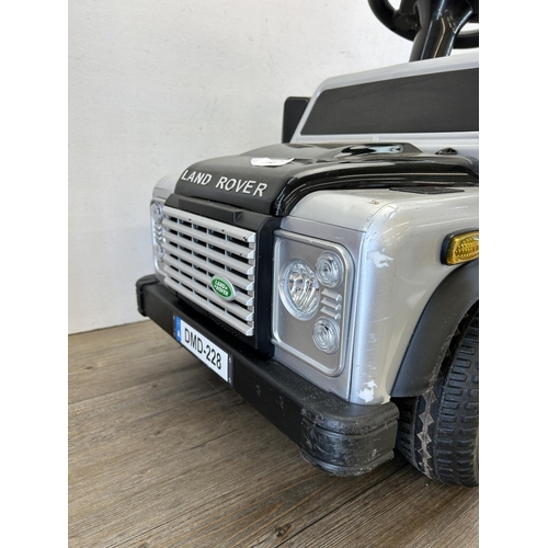 342 - A Land Rover Defender electric child's ride on car with charger