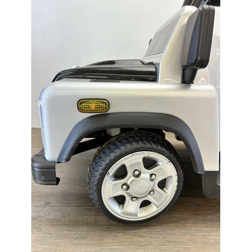 342 - A Land Rover Defender electric child's ride on car with charger