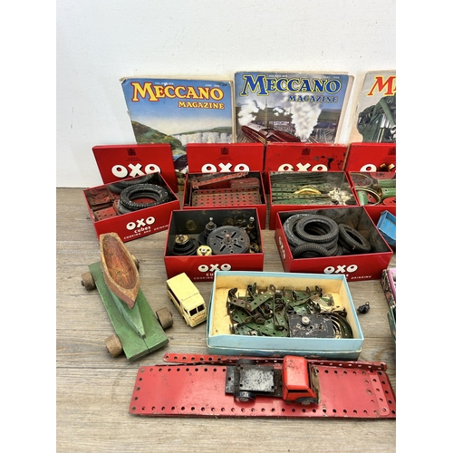 343 - A large collection of vintage Meccano accessories to include 1939 magazines, fixings, fittings etc.