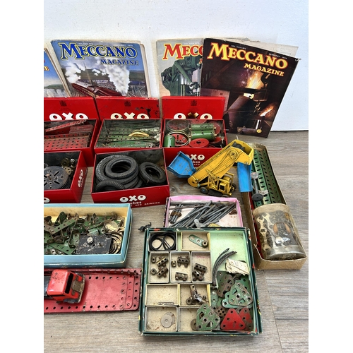 343 - A large collection of vintage Meccano accessories to include 1939 magazines, fixings, fittings etc.