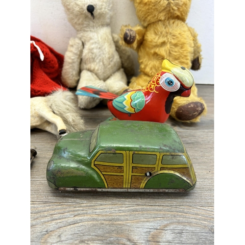 347 - A collection of vintage toys to include tin plate clockwork Parrot and car, clockwork horse and tedd... 