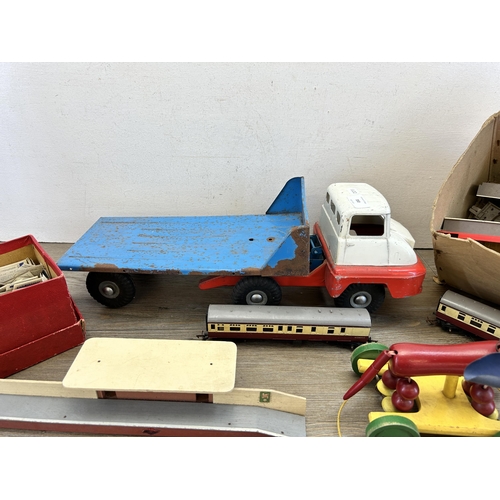 350 - A collection of vintage toys to include Tri-ang Transport tinplate tow truck, Tri-ang model railway ... 