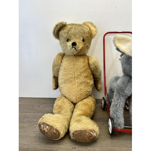 358 - Three vintage soft toys, one Pedigree push along horse and two articulated teddy bears