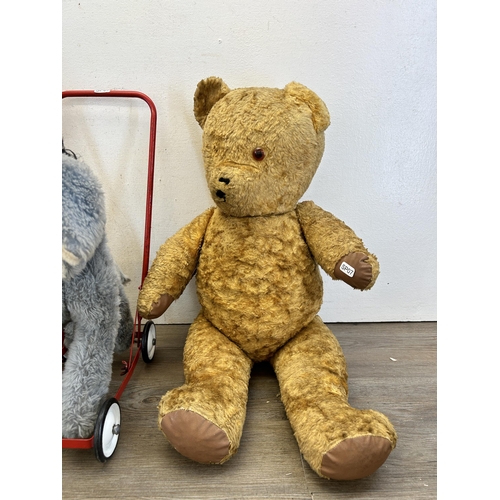 358 - Three vintage soft toys, one Pedigree push along horse and two articulated teddy bears