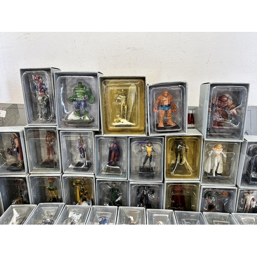 359 - A large collection of Marvel accessories to include approx. 49 boxed The Classic Marvel figurines wi... 