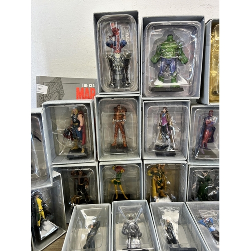 359 - A large collection of Marvel accessories to include approx. 49 boxed The Classic Marvel figurines wi... 