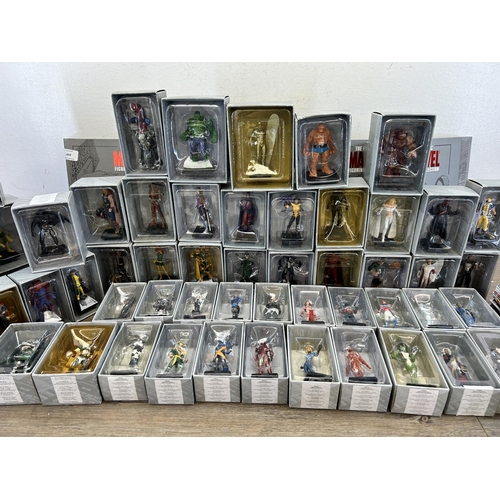 359 - A large collection of Marvel accessories to include approx. 49 boxed The Classic Marvel figurines wi... 