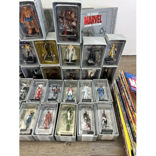 359 - A large collection of Marvel accessories to include approx. 49 boxed The Classic Marvel figurines wi... 