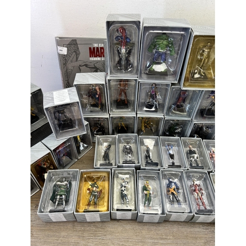 359 - A large collection of Marvel accessories to include approx. 49 boxed The Classic Marvel figurines wi... 