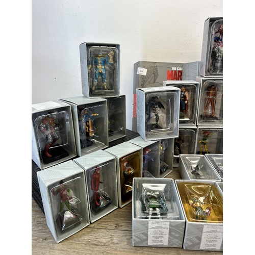 359 - A large collection of Marvel accessories to include approx. 49 boxed The Classic Marvel figurines wi... 