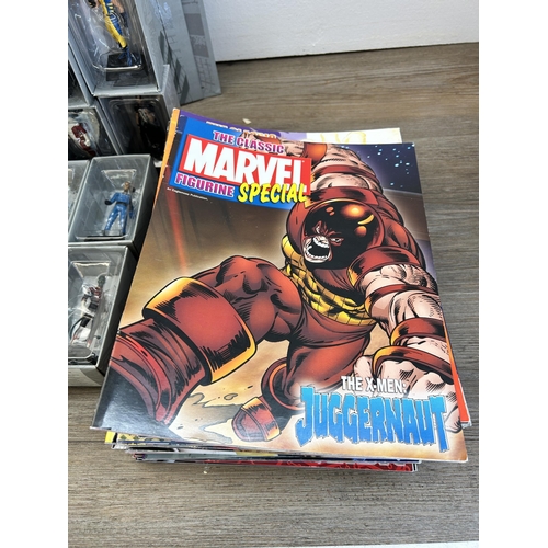 359 - A large collection of Marvel accessories to include approx. 49 boxed The Classic Marvel figurines wi... 