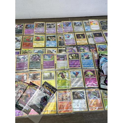 363 - A collection of Pokémon trading cards to include Sun & Moon Comic Eclipse, Sun & Moon Celestial Stor... 