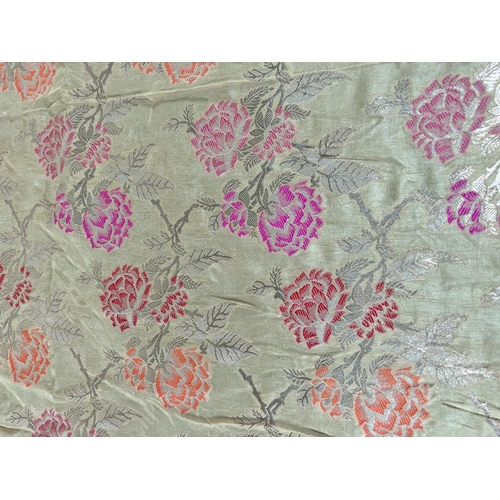 376 - A large Indian Silk floral patterned table runner - approx. 550cm x 110cm