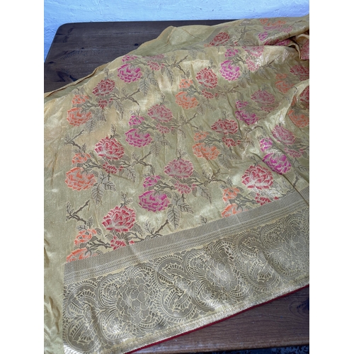 376 - A large Indian Silk floral patterned table runner - approx. 550cm x 110cm