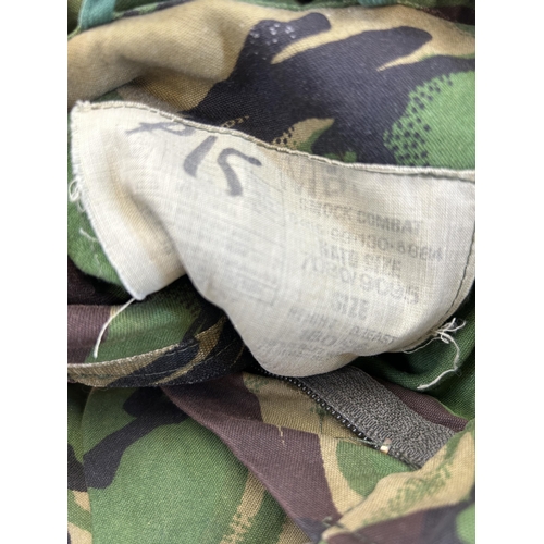 386 - Five pieces of military clothing to include British Army Woodland pattern combat jacket and Para smo... 